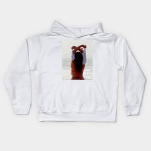 Girl at the beach getting ready for a bath Kids Hoodie